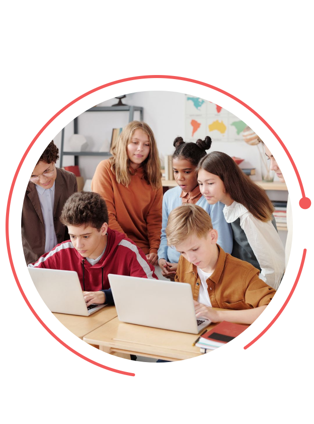 School students learning together on laptops
